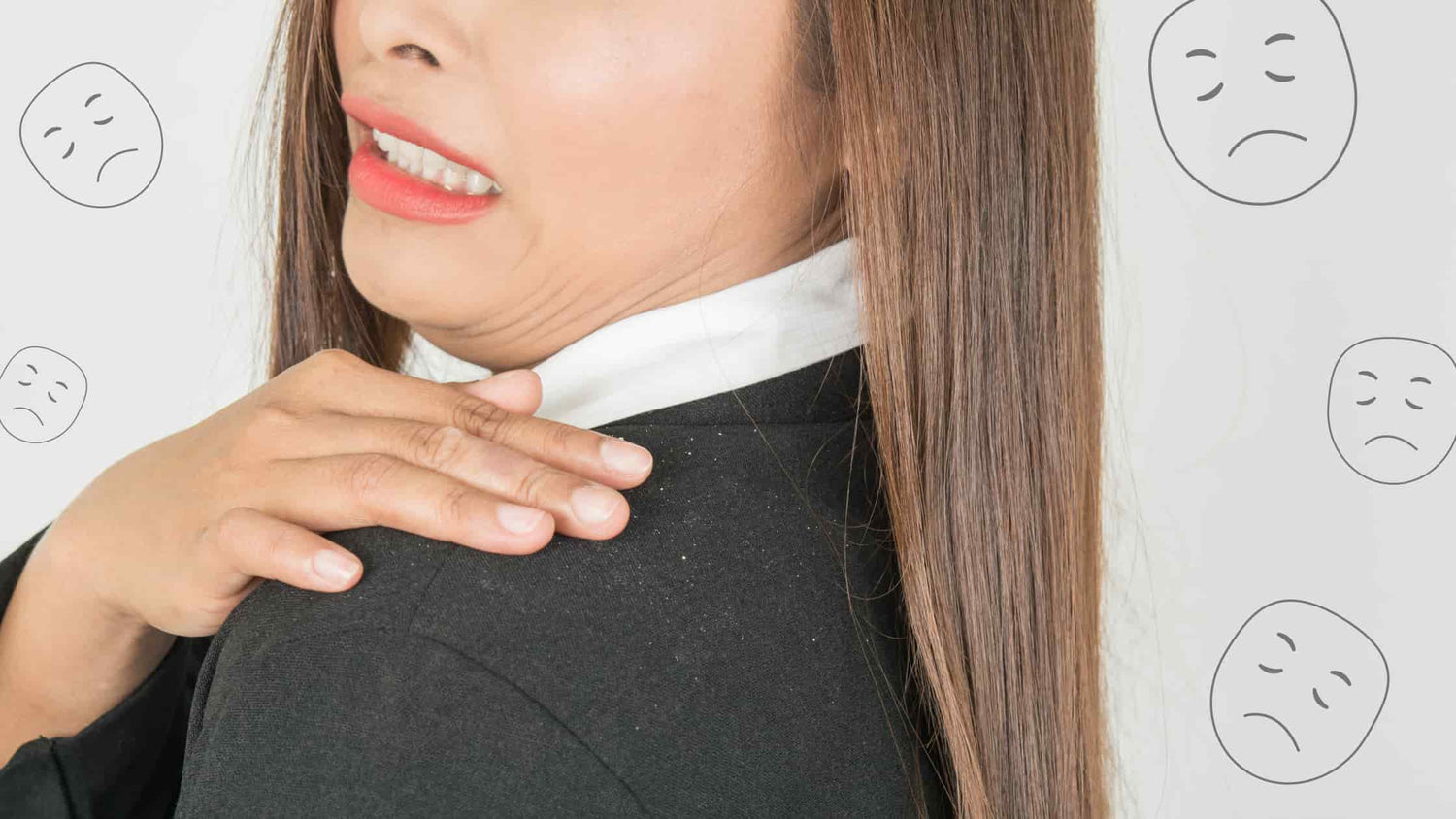 woman having dandruff fall off her shoulders