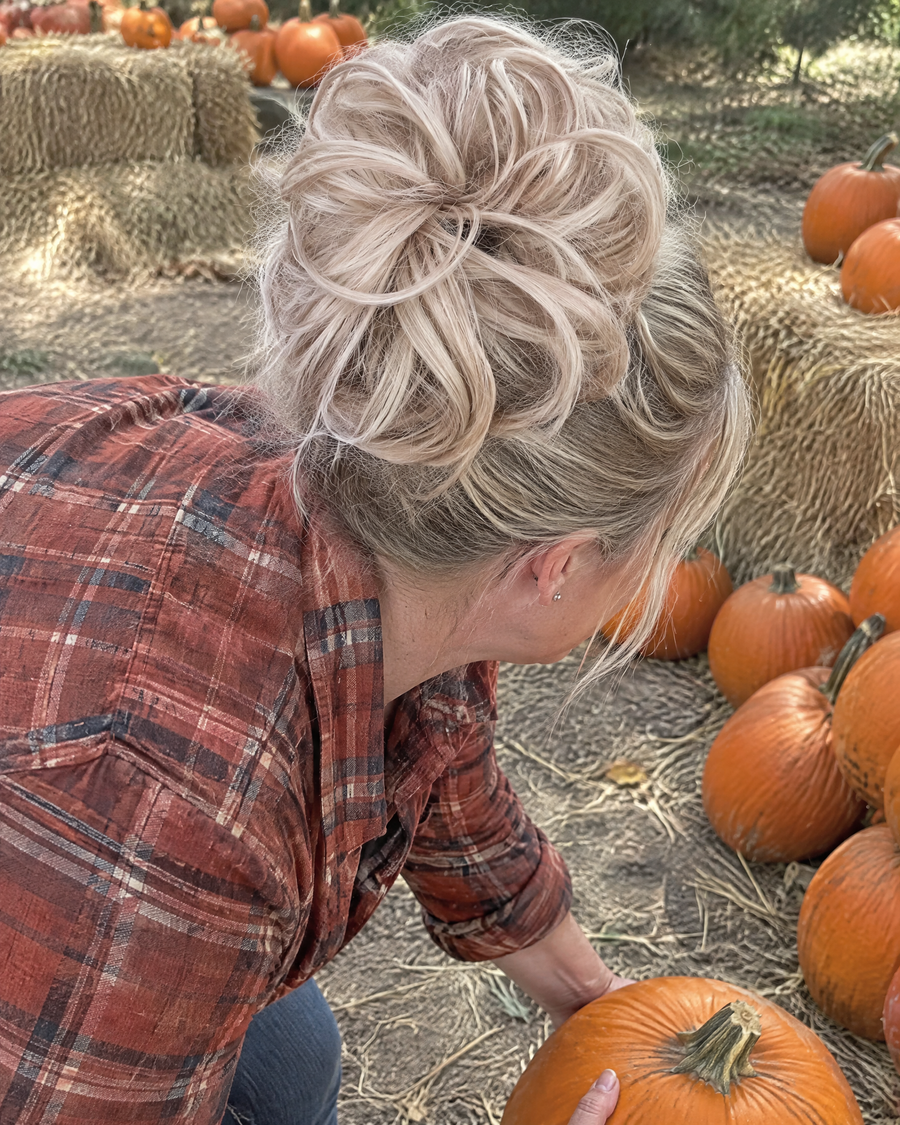 Woman wearing the JuvaBun Messy Bun in Light Brownish Blonde at a pumpkin patch