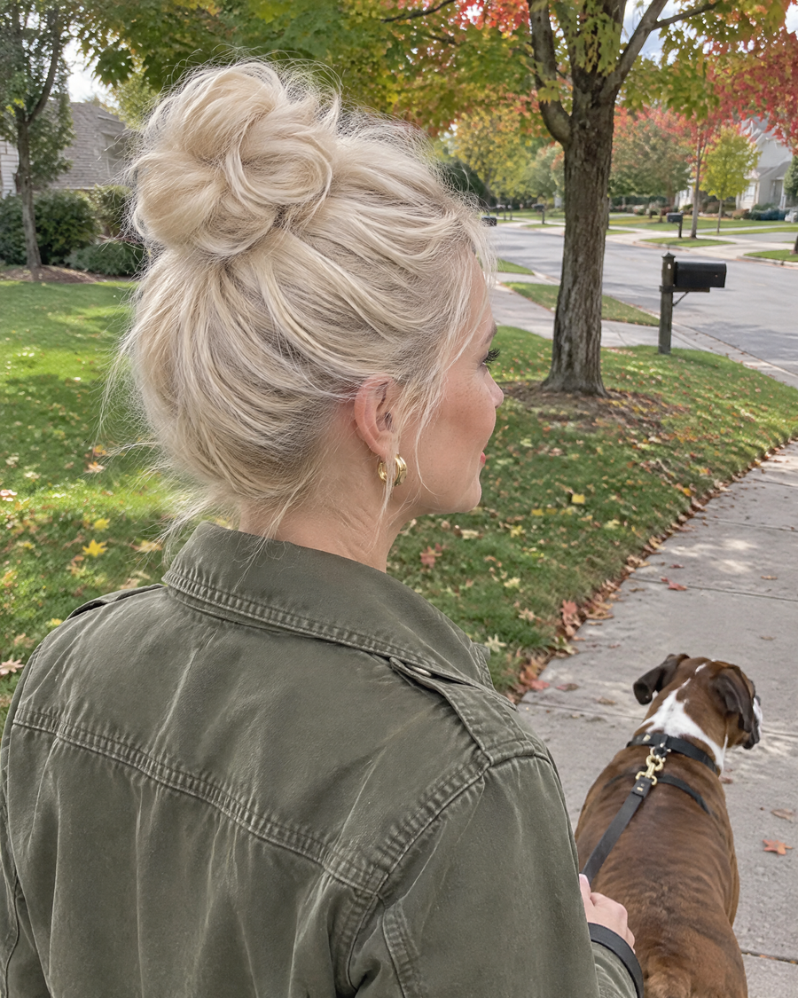 Woman wearing the JuvaBun Messy Bun in Platinum Blonde on a dog walk