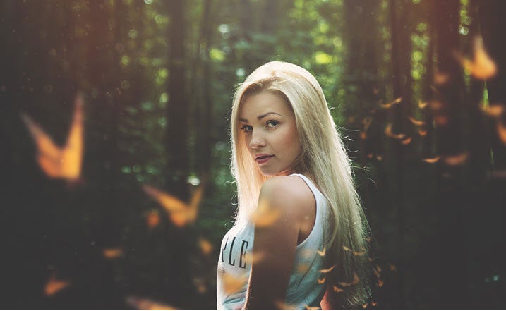 blond woman surrounded by butterflies