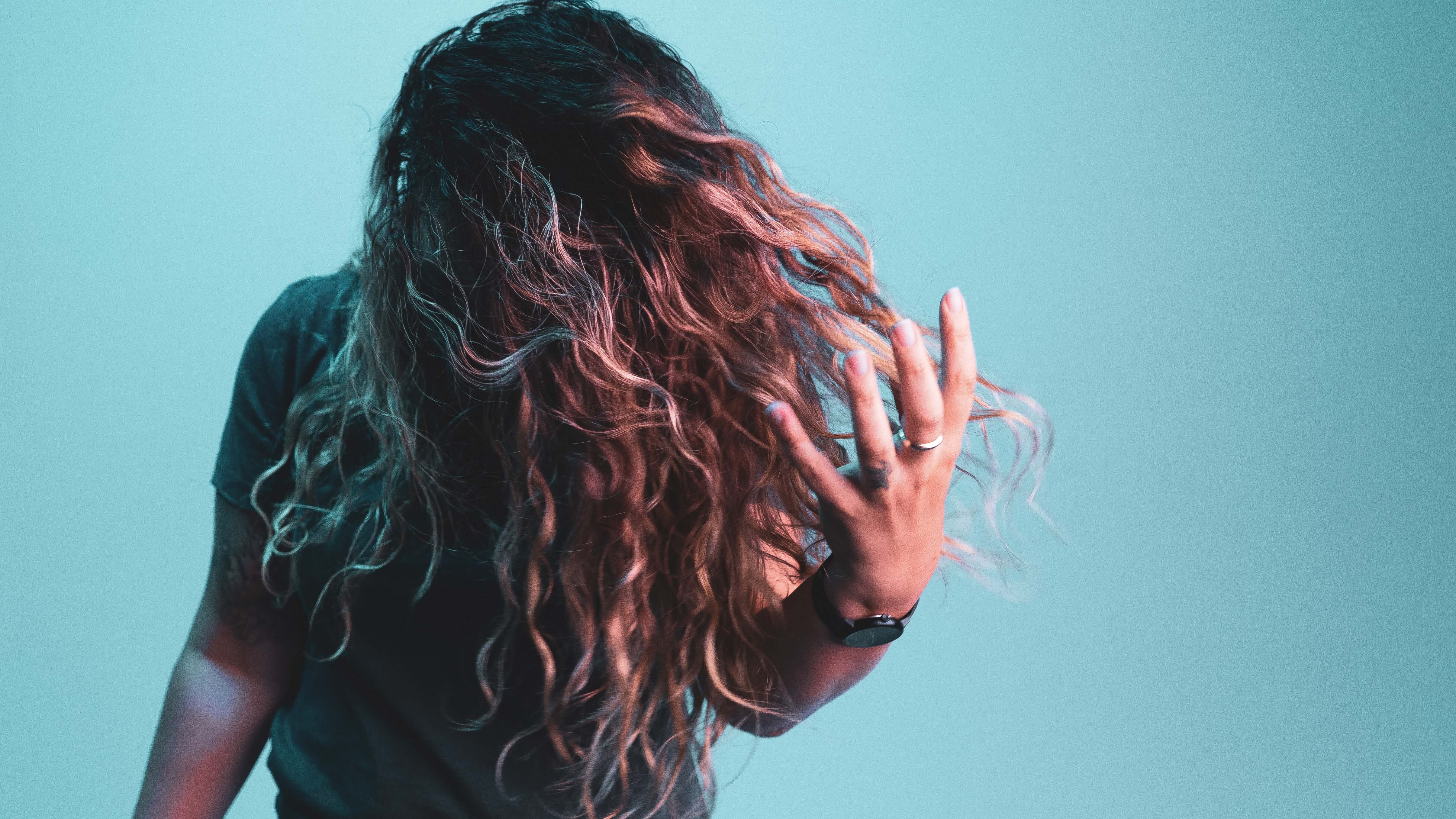 woman whipping her hair back and forth