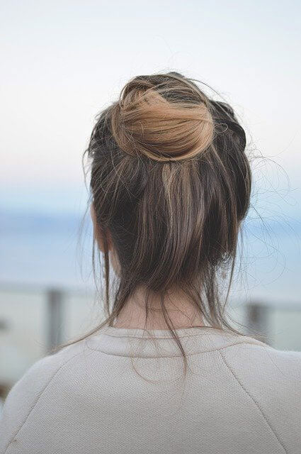 Back view of messy bun hair style