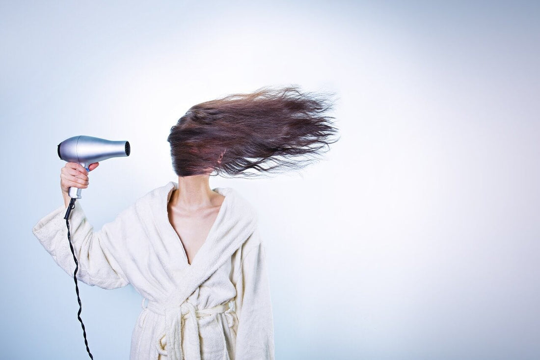 lady drying her hair