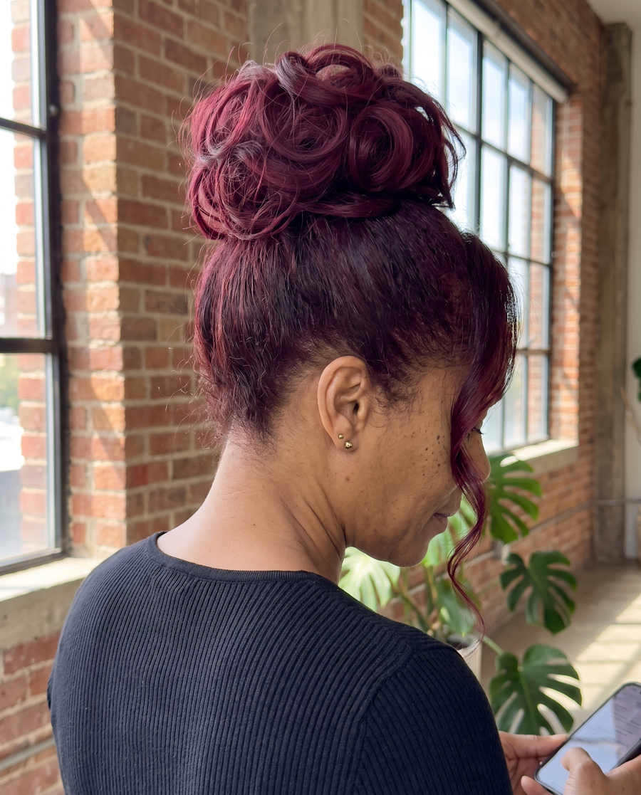 JuvaBun Messy Bun in Burg on a woman with burgundy hair, back and side view