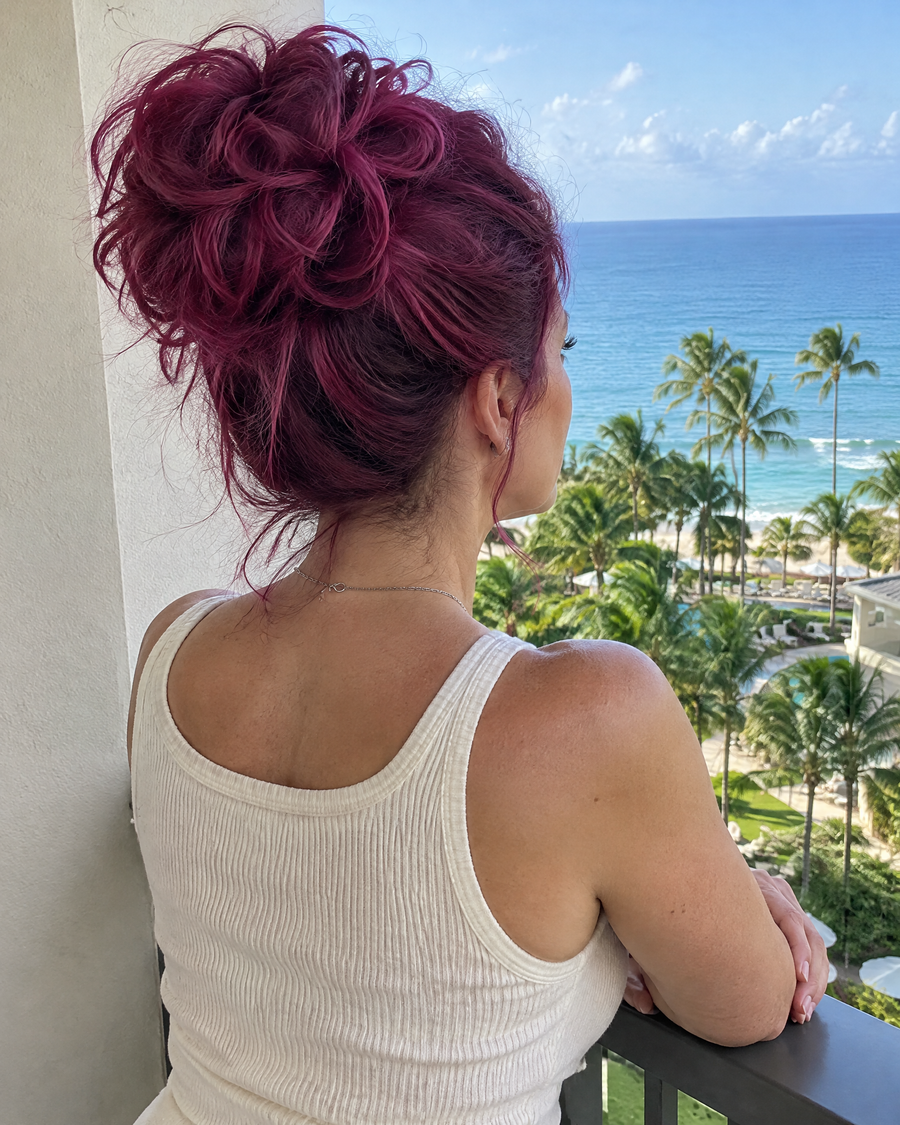 Woman wearing the JuvaBun Messy Bun in Burg on vacation