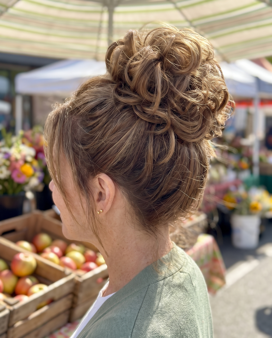 JuvaBun Messy Bun in Light Brown on a woman with light brown highlighted hair, close-up of the bun