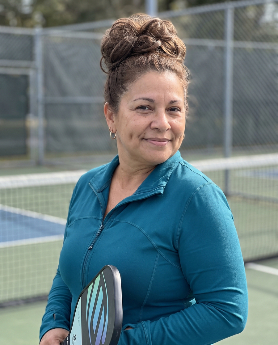 Woman wearing the JuvaBun Messy Bun in Medium Brown at the pickleball court