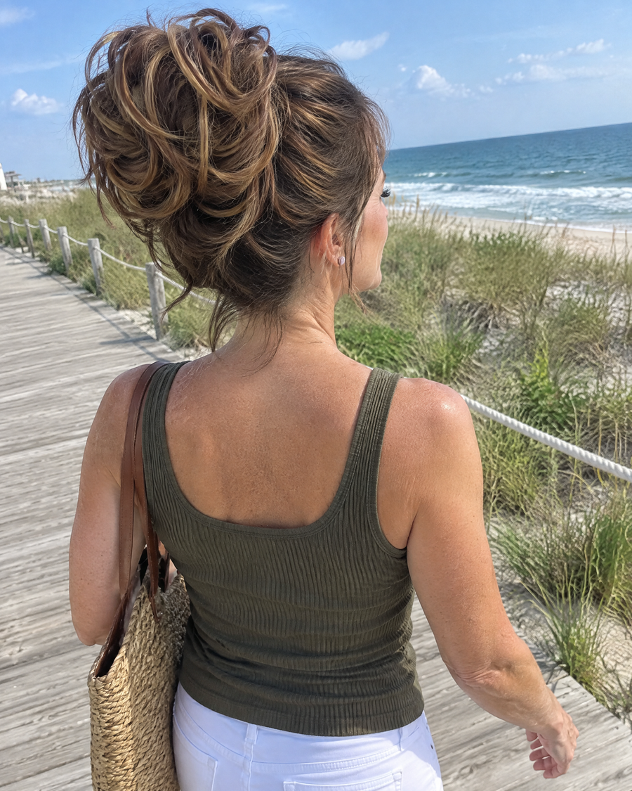 Woman wearing the JuvaBun Messy Bun in Mix Walnut on the boardwalk