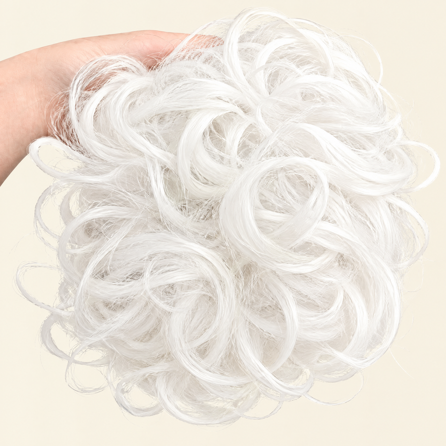 Hand holding the full JuvaBun Messy Bun in White